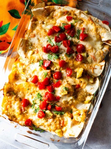 Shrimp burritos baked in a casserole dish.